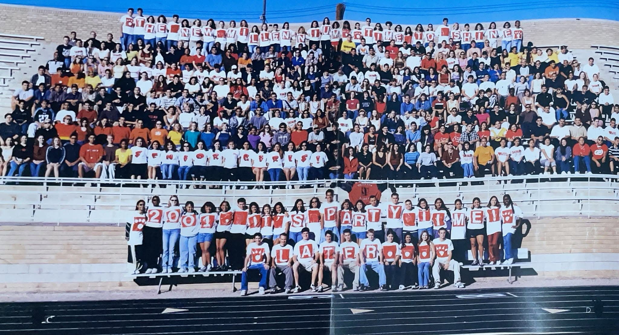 The Tucson High Class of 2001, spelling out a senior class message in the stadium bleachers